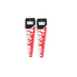 Close-up of Halloween acrylic saw charms with realistic red blood stains for DIY crafts