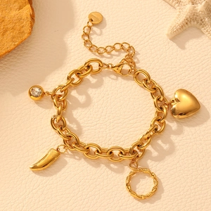 Detailed view of a gold stainless steel bracelet with heart charms and crystal accents