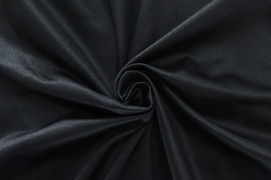 Detail of sleek black satin fabric showing smooth texture and elegant spiral draping