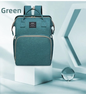 Front view of green waterproof diaper backpack with large capacity and multi-function pockets