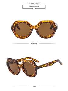 Detail view of tortoiseshell frames and brown lenses on retro oversized sunglasses