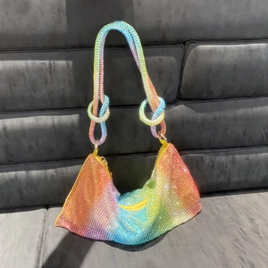 Macro detail of rainbow rhinestone shoulder bag with unique knotted handle design
