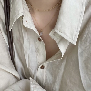 Layered 925 sterling silver gold necklace with beaded chain and crystal pendant