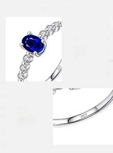 Detailed view of S925 sterling silver stamp and oval blue gemstone with pavé zircon