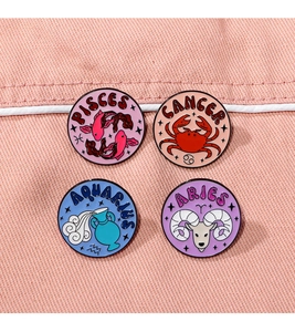 Detail of four enamel zodiac pins showing Pisces, Cancer, Aquarius, and Aries designs