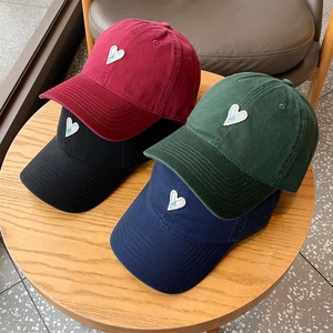 Breathable cotton baseball caps with embroidered hearts in red, black, green and navy