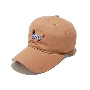 Detailed close-up of a cute dachshund embroidery on a khaki cotton baseball cap