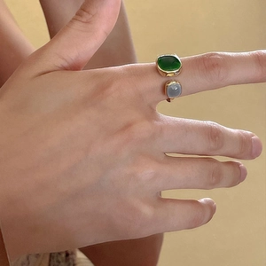 Elegant gold open ring featuring a square emerald and round purple gemstone for women