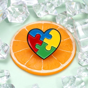 Rainbow heart puzzle piece enamel brooch on fruit and ice for autism awareness