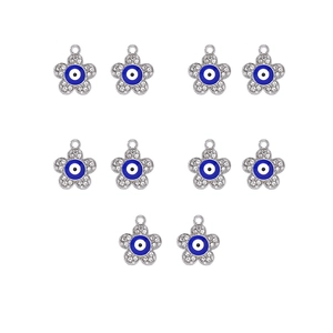 Detailed view of silver flower charms with blue evil eye enamel and zircon inlay