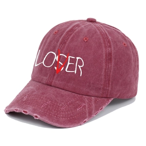 Close-up of distressed vintage burgundy baseball cap with LOSER embroidery details