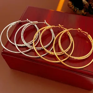 Three-layer gold and silver plated hoop earrings set with smooth and textured finishes