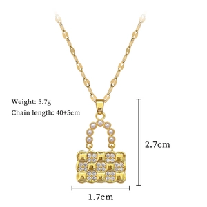 Detailed view of golden handbag pendant with pearls and zircons, including measurements