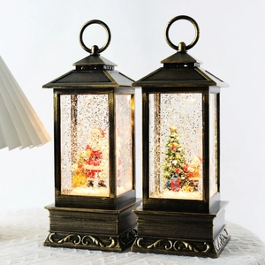 Vintage bronze Christmas snow globe lanterns with Santa Claus and festive LED lights