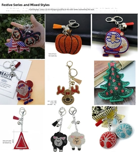 Detailed view of rhinestone holiday keychains with tassels showing sizes and weights