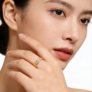 18K gold plated titanium steel ring with channel set diamonds worn on an index finger