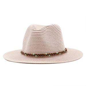 Handwoven western straw cowboy hat with ethnic bead band for beach sun protection