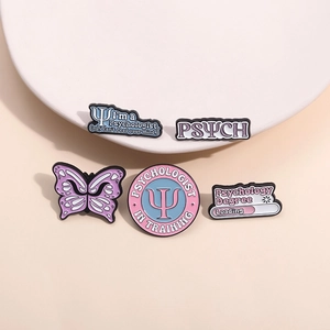 5-piece psychology enamel pin set with butterfly and psi symbols on pink background