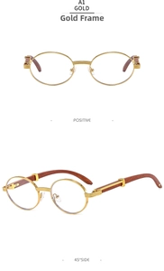 Detail of vintage oval gold metal glasses with brown wood temples and clear lenses
