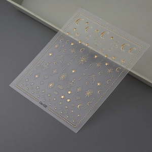 Star and moon gold foil nail stickers with celestial patterns for DIY manicure art