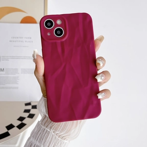 Modern deep pink wrinkled silicone protective case for iPhone 15 Pro Max handheld view