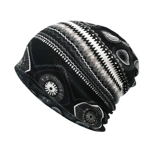 Macro detail of elastic knitted beanie featuring bohemian ethnic geometric patterns