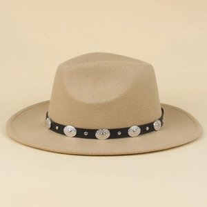 Detail of khaki fedora hat featuring a black leather band with silver metal rivets and studs