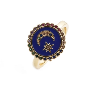 Detail of adjustable gold ring with blue star and moon face surrounded by colorful gems