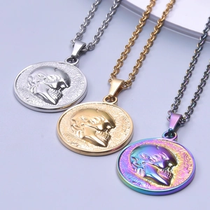 Macro view of skull relief coin pendants in silver gold and rainbow plating