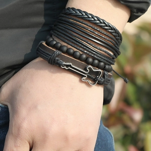 Multilayer braided leather bracelet set with guitar metal charm on model wrist