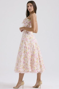 Detail of floral summer maxi dress with spaghetti straps and ruched drawstring neckline