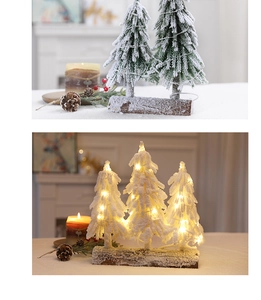 Mini snowy Christmas trees with LED lights on wooden base for festive table decor