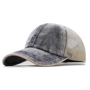 Vintage washed denim trucker hat with breathable mesh back and curved brim for sun protection