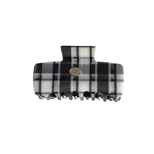 Classic black and white checkered hair claw clip with silver POKO FOSCA brand plaque