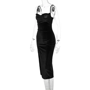 Detail of the side slit and velvet texture on a black slim fit midi camisole dress