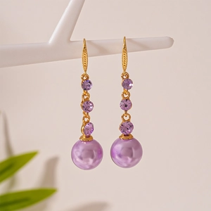 Elegant purple pearl drop earrings with sparkling rhinestones and gold-plated hooks
