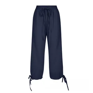 Detail of navy cotton linen wide leg pants with elastic drawstring waist and ankle ties