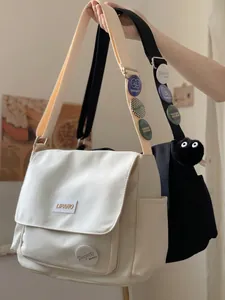 LIPANO canvas messenger bag with decorative badges and plush pendant for students