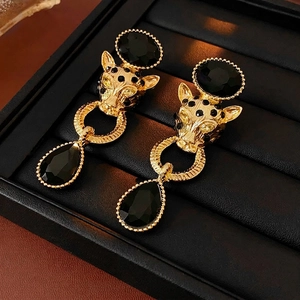 Vintage gold leopard head earrings with black teardrop crystal charms and stone inlay