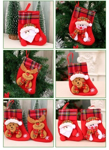 Close-up of four Christmas stockings featuring Santa, Snowman, Reindeer, and Bear motifs