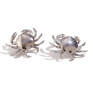 Polished silver crab stud earrings with intricate anatomical details on white background