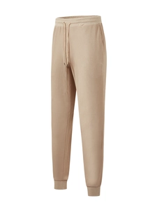 Detail view of khaki waffle knit trousers featuring drawstring waist and ribbed cuffs