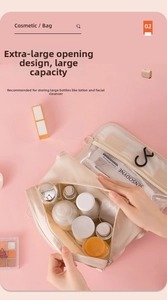 Top view of beige toiletry bag with large opening showing spacious interior compartments
