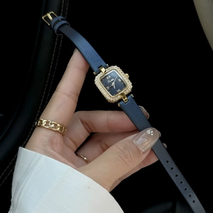 Elegant gold square watch for women with rhinestones and a blue leather strap