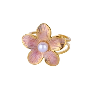 Detailed close-up of a pink gradient flower ring with a center pearl and golden double band