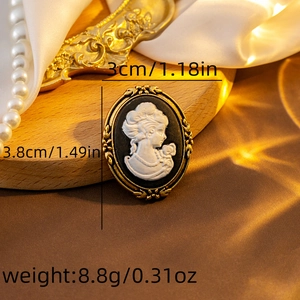 Detailed view of vintage cameo brooch with measurements and elegant gold floral frame