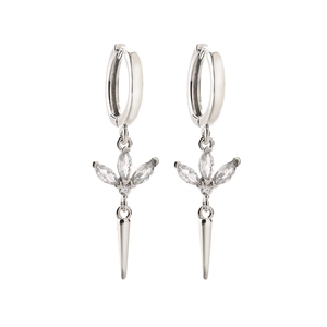 Macro detail of silver-tone huggie earrings with marquise stones and conical pendants