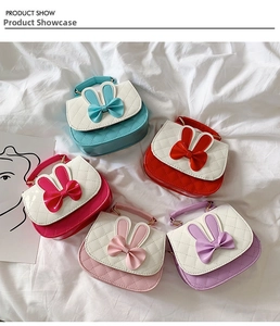 Detailed display of five colorful cartoon rabbit ear crossbody bags with bow accents