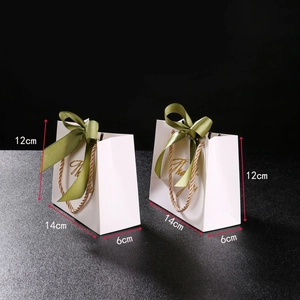 Small white gift bags with green ribbons and gold Thank You text, size 14x12x6cm