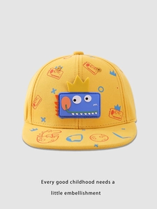 Detail of yellow kids snapback hat with blue rubber dinosaur patch and crown detail